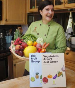Chef-K Laurie with Books Vegetables Aren't Just Green and The Fruit Group